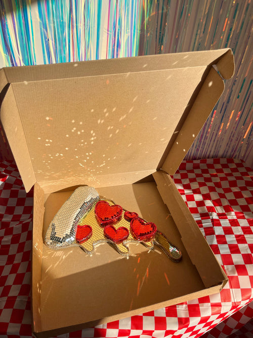 Disco ball pizza slice in pizza box on red and white tablecloth. Town Girl Disco